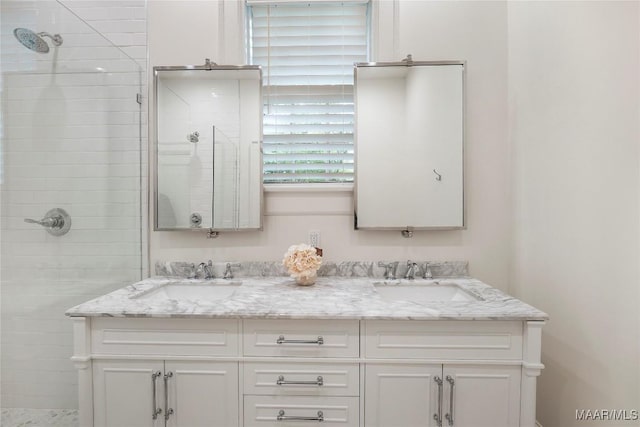 3328 Lebron Rd, Montgomery, AL 36106 - bathroom featuring tiled shower and double vanity