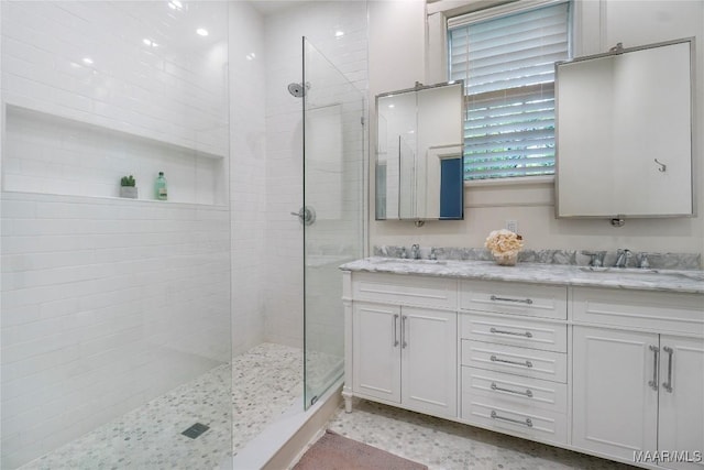 3328 Lebron Rd, Montgomery, AL 36106 - full bathroom featuring walk in shower, double vanity, and speckled floor