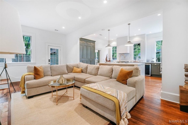 3328 Lebron Rd, Montgomery, AL 36106 - living room featuring beverage cooler, wood finished floors, recessed lighting, and baseboards