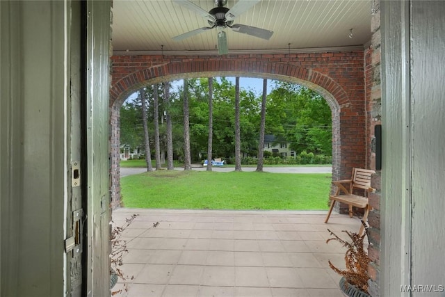 3328 Lebron Rd, Montgomery, AL 36106 - doorway with brick wall, ceiling fan, and tile patterned flooring