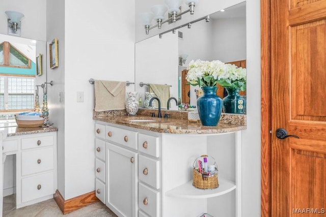 258 S Conecuh St, Greenville, AL 36037 - bathroom with vanity, tile patterned floors, and baseboards