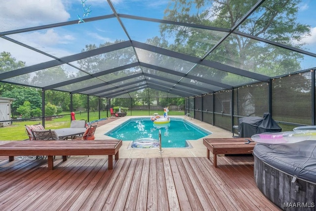 258 S Conecuh St, Greenville, AL 36037 - swimming pool featuring a wooden deck, a patio area, and glass enclosure