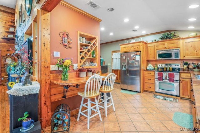 258 S Conecuh St, Greenville, AL 36037 - kitchen featuring stainless steel appliances, crown molding, recessed lighting, light tile patterned floors, and open shelves