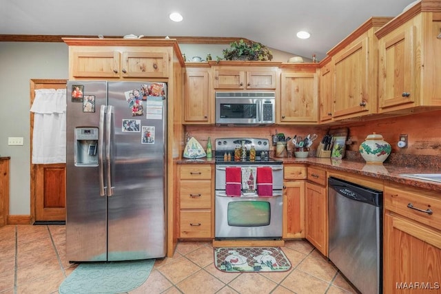 258 S Conecuh St, Greenville, AL 36037 - kitchen featuring stainless steel appliances, light tile patterned floors, lofted ceiling, recessed lighting, and crown molding