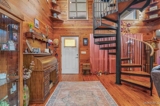 258 S Conecuh St, Greenville, AL 36037 - foyer with wooden walls, stairway, and hardwood / wood-style flooring