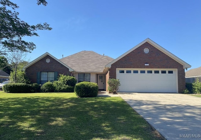 1853 Sanford Dr, Prattville, AL 36066 - single story home with brick siding, a front yard, concrete driveway, and a garage