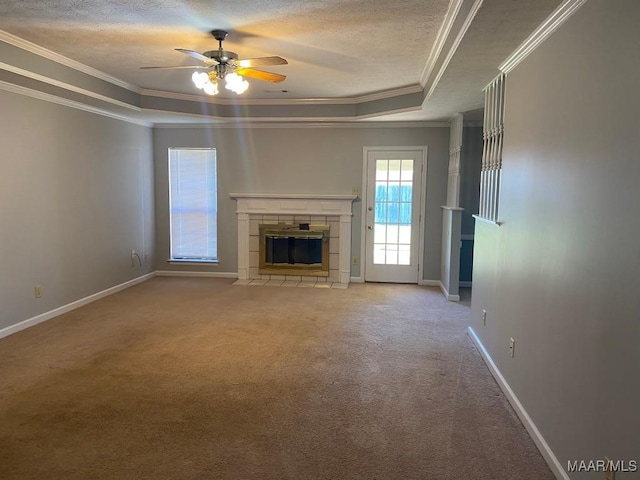 1853 Sanford Dr, Prattville, AL 36066 - unfurnished living room with a tray ceiling, ceiling fan, carpet, a textured ceiling, and a stone fireplace