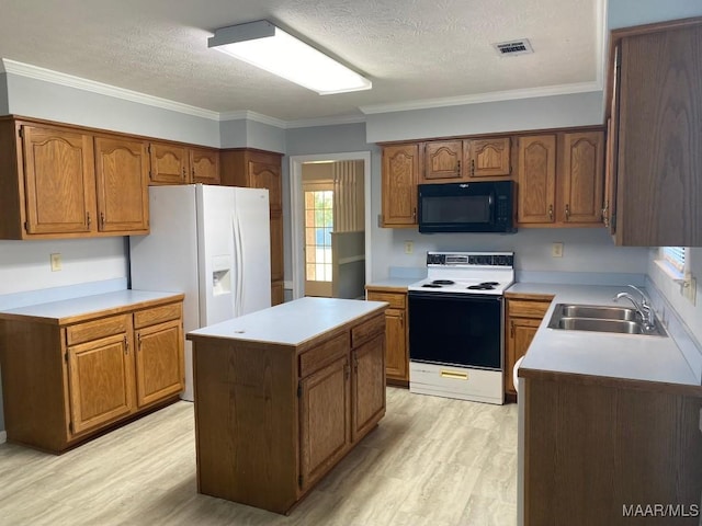 1853 Sanford Dr, Prattville, AL 36066 - kitchen with black microwave, electric stove, a sink, white fridge with ice dispenser, and light wood-type flooring