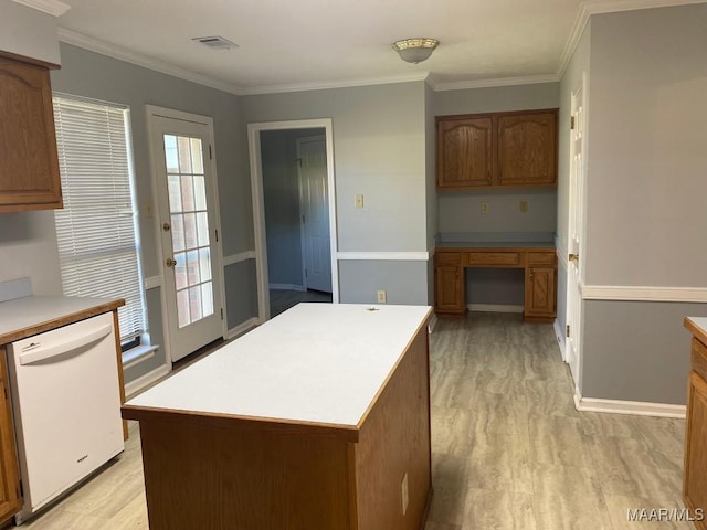 1853 Sanford Dr, Prattville, AL 36066 - kitchen featuring white dishwasher, light countertops, light wood-type flooring, and ornamental molding