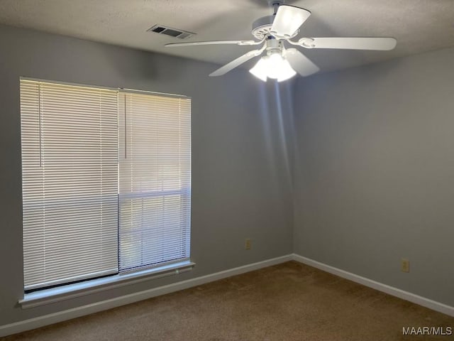1853 Sanford Dr, Prattville, AL 36066 - spare room with a ceiling fan, carpet floors, baseboards, and a textured ceiling