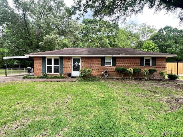 3740 Martha Ln, Millbrook, AL 36054 - ranch-style home featuring brick siding, a carport, driveway, and view of scattered trees