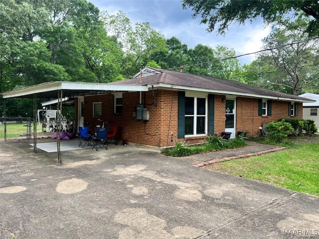 3740 Martha Ln, Millbrook, AL 36054 - view of front of home with a carport, brick siding, and driveway