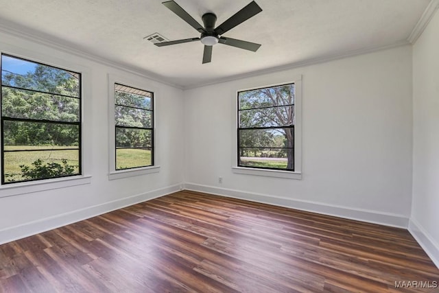 1582 W Old Hayneville Rd, Le Grand, AL 36105 - empty room featuring plenty of natural light, crown molding, baseboards, wood finished floors, and a ceiling fan