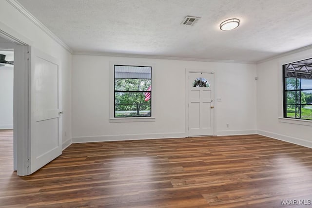 1582 W Old Hayneville Rd, Le Grand, AL 36105 - foyer featuring crown molding, wood finished floors, a textured ceiling, and baseboards