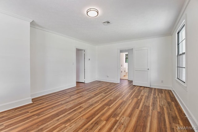 1582 W Old Hayneville Rd, Le Grand, AL 36105 - spare room featuring wood finished floors, ornamental molding, and baseboards