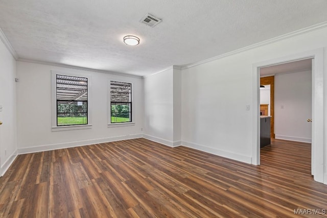 1582 W Old Hayneville Rd, Le Grand, AL 36105 - spare room featuring ornamental molding, a textured ceiling, wood finished floors, and baseboards