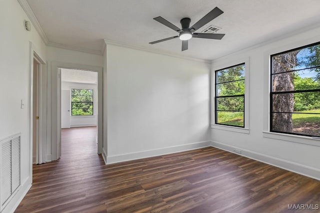 1582 W Old Hayneville Rd, Le Grand, AL 36105 - spare room featuring crown molding, dark wood finished floors, baseboards, a ceiling fan, and a smoke detector