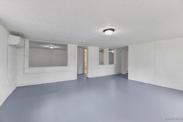 1582 W Old Hayneville Rd, Le Grand, AL 36105 - finished basement with an AC wall unit and a textured ceiling