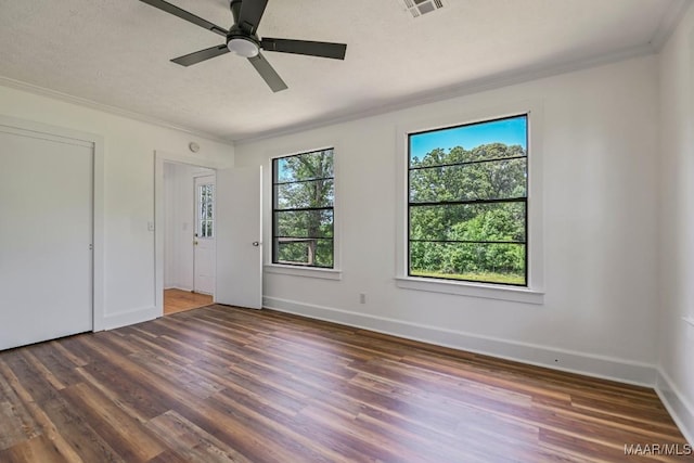 1582 W Old Hayneville Rd, Le Grand, AL 36105 - unfurnished bedroom featuring crown molding, wood finished floors, baseboards, and a ceiling fan