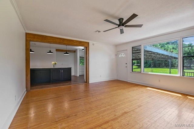1582 W Old Hayneville Rd, Le Grand, AL 36105 - unfurnished living room featuring light wood-style floors, crown molding, ceiling fan, and baseboards