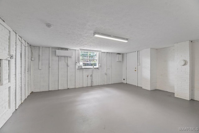 1582 W Old Hayneville Rd, Le Grand, AL 36105 - basement with a wall unit AC and a textured ceiling