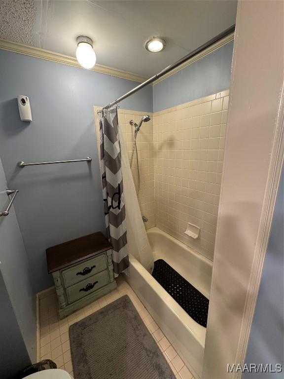215 W Castlewood Dr, Selma, AL 36701 - bathroom with shower / bath combo with shower curtain, ornamental molding, and tile patterned flooring