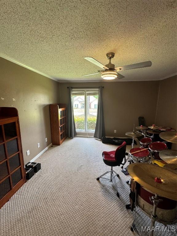 215 W Castlewood Dr, Selma, AL 36701 - living area with a textured ceiling, carpet, ornamental molding, ceiling fan, and baseboards