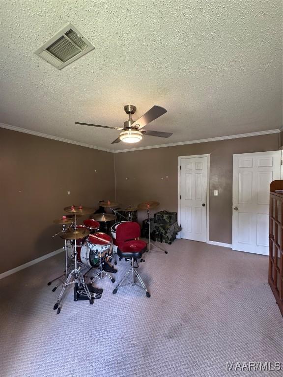 215 W Castlewood Dr, Selma, AL 36701 - game room featuring crown molding, a textured ceiling, ceiling fan, baseboards, and carpet flooring