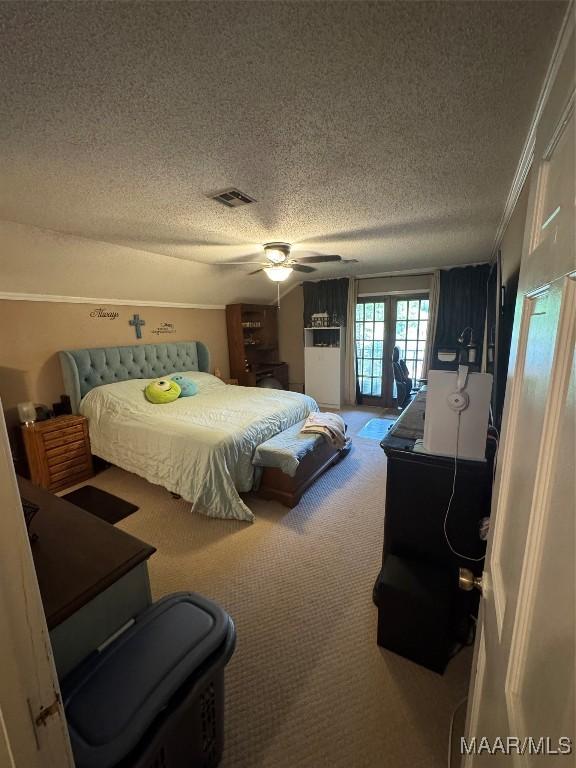 215 W Castlewood Dr, Selma, AL 36701 - carpeted bedroom with a textured ceiling, ornamental molding, ceiling fan, and access to exterior