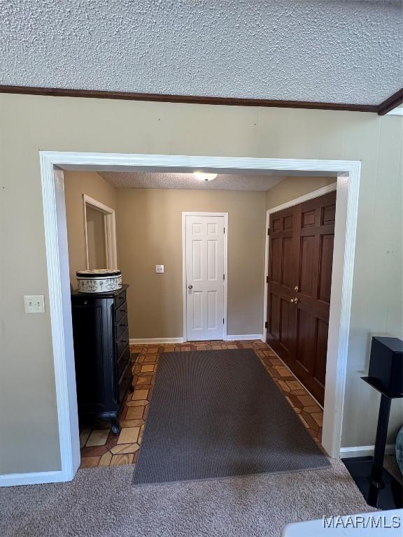 215 W Castlewood Dr, Selma, AL 36701 - foyer with a textured ceiling, baseboards, and crown molding