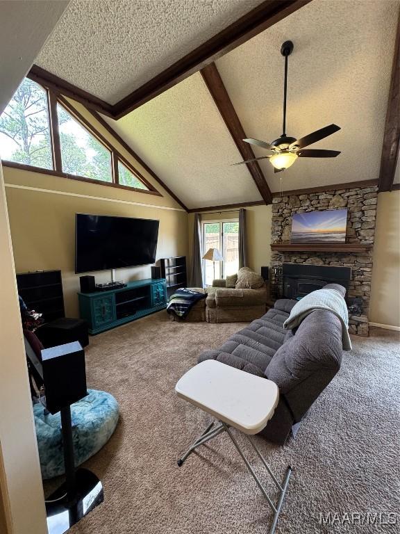 215 W Castlewood Dr, Selma, AL 36701 - living area featuring a textured ceiling, carpet, a ceiling fan, and a fireplace