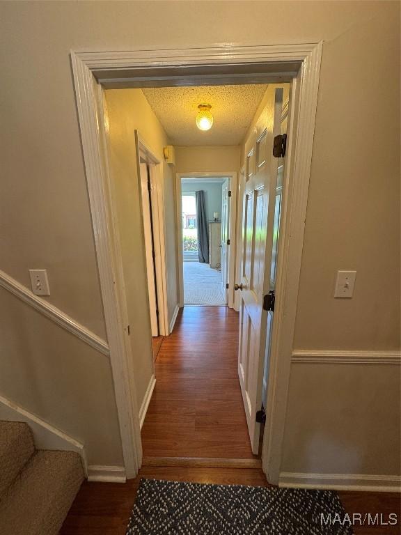 215 W Castlewood Dr, Selma, AL 36701 - corridor featuring wood finished floors, baseboards, and stairway