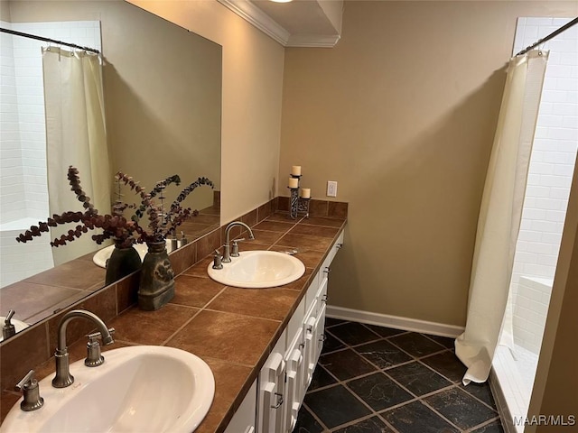 11 Wilkins Rd, Selma, AL 36701 - bathroom with double vanity, crown molding, baseboards, and inlaid floor details