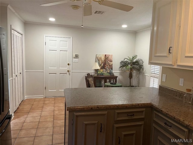 11 Wilkins Rd, Selma, AL 36701 - kitchen with a peninsula, a ceiling fan, crown molding, light tile patterned floors, and recessed lighting