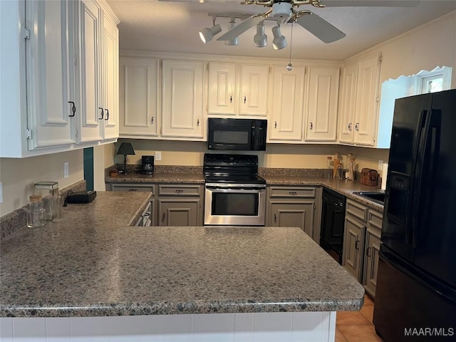 11 Wilkins Rd, Selma, AL 36701 - kitchen with black appliances, white cabinets, and a peninsula