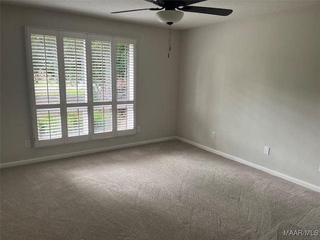 11 Wilkins Rd, Selma, AL 36701 - unfurnished room featuring ceiling fan, baseboards, and carpet floors