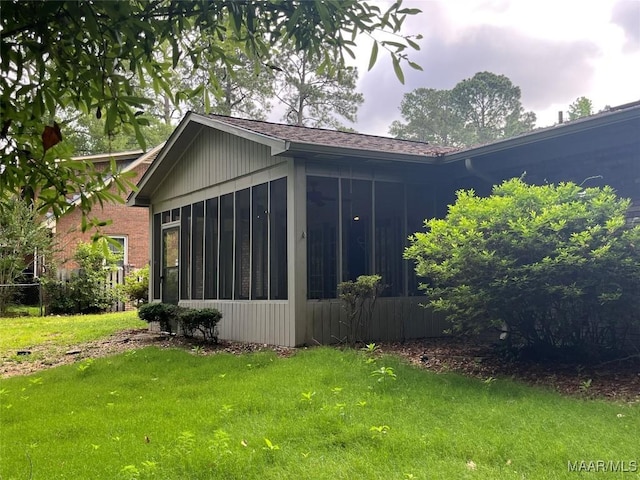 11 Wilkins Rd, Selma, AL 36701 - view of side of property with a sunroom and a lawn