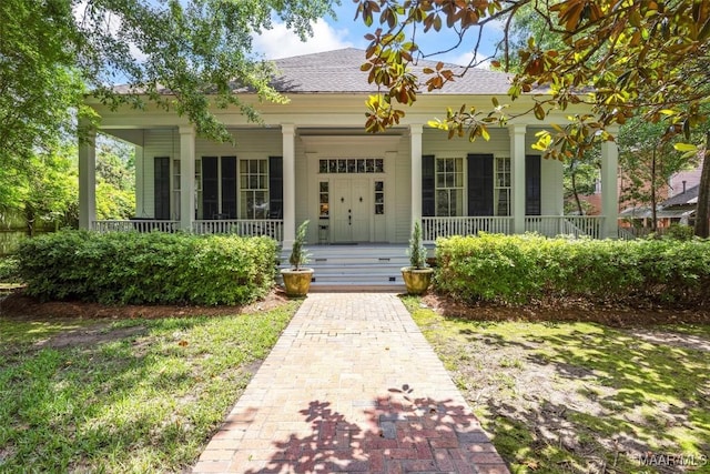 1533 Gilmer Ave, Montgomery, AL 36104 - view of exterior entry featuring covered porch and a shingled roof