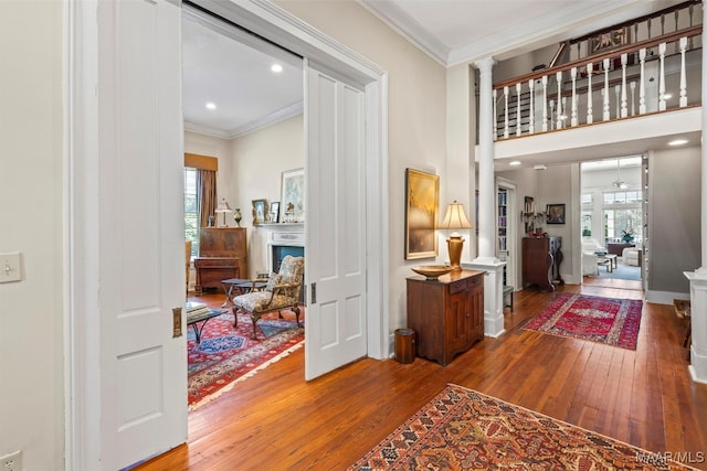 1533 Gilmer Ave, Montgomery, AL 36104 - foyer with hardwood / wood-style floors, plenty of natural light, crown molding, a fireplace, and ornate columns
