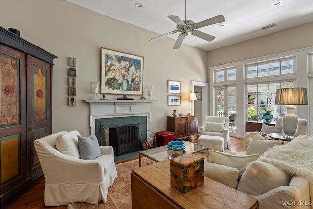 1533 Gilmer Ave, Montgomery, AL 36104 - living room featuring a fireplace, wood finished floors, ceiling fan, and recessed lighting