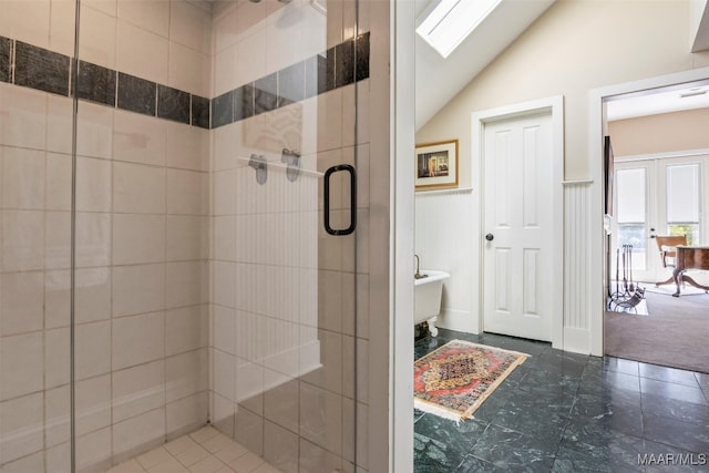 1533 Gilmer Ave, Montgomery, AL 36104 - full bath featuring a stall shower, lofted ceiling, tile patterned floors, and french doors
