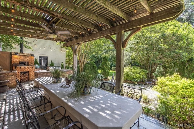 1533 Gilmer Ave, Montgomery, AL 36104 - view of patio / terrace featuring an outdoor brick fireplace, a ceiling fan, a pergola, and outdoor dining space