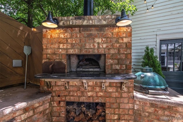 1533 Gilmer Ave, Montgomery, AL 36104 - view of patio with an outdoor brick fireplace