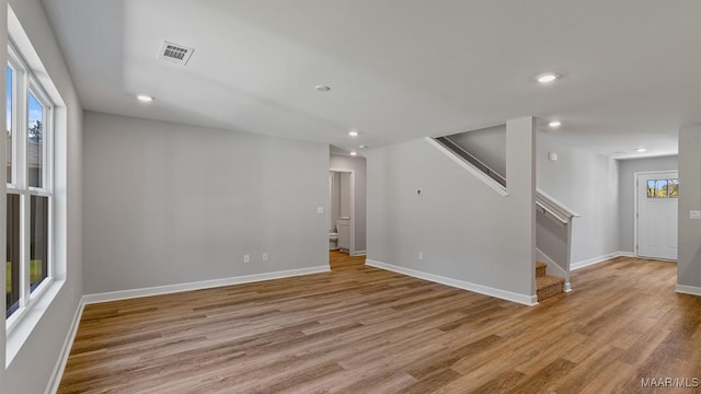 6008 Cunningham Trl, Montgomery, AL 36116 - empty room with stairway, light wood-style floors, recessed lighting, and baseboards