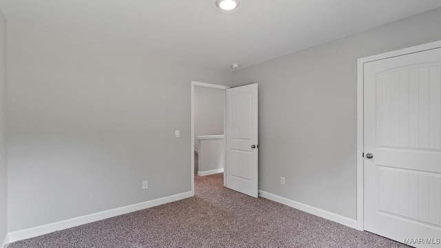 6008 Cunningham Trl, Montgomery, AL 36116 - unfurnished bedroom with carpet floors and baseboards
