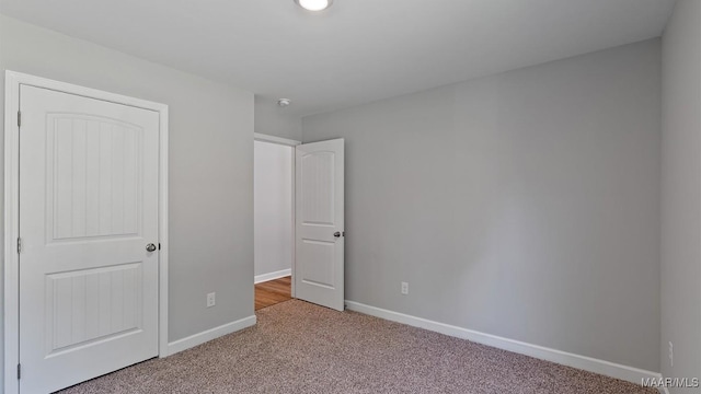 6008 Cunningham Trl, Montgomery, AL 36116 - unfurnished bedroom with light carpet and baseboards
