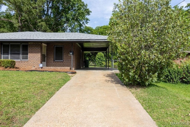 3119 Gaston Ave, Montgomery, AL 36105 - view of front of house featuring brick siding, a front lawn, driveway, and an attached carport