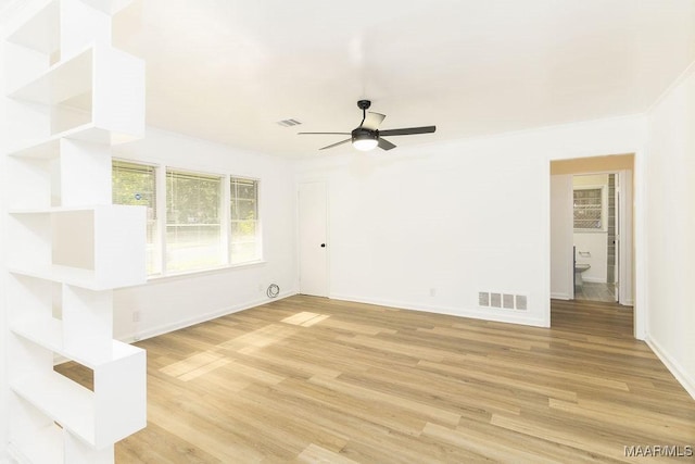 3119 Gaston Ave, Montgomery, AL 36105 - empty room with ceiling fan, light wood-style flooring, and baseboards