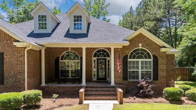 512 Golson Rd, Prattville, AL 36067 - view of front of home featuring brick siding, covered porch, and roof with shingles