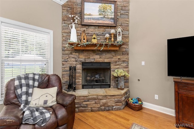 512 Golson Rd, Prattville, AL 36067 - living room featuring wood finished floors, baseboards, and a fireplace